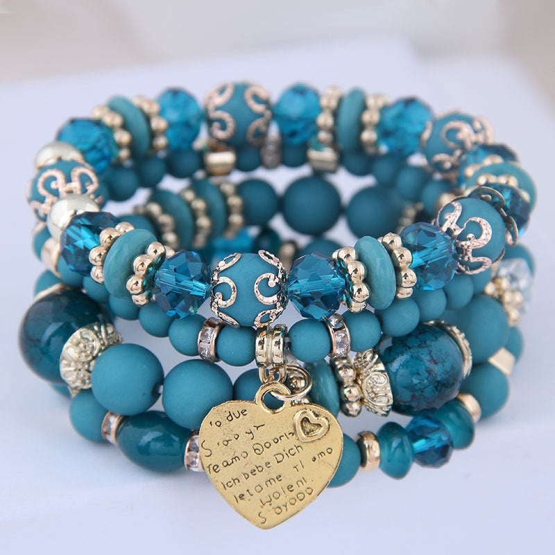 Ensemble de 4 bracelets multirangs bleu turquoise avec perles, détails dorés et pendentif cœur